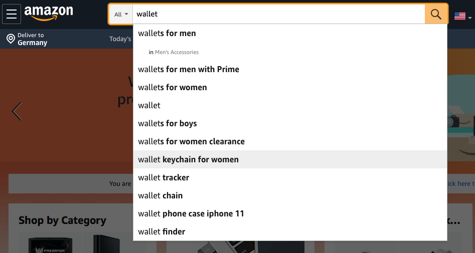 Image of the Amazon search bar with the keyword wallet as an example for keyword research with Amazon Suggest